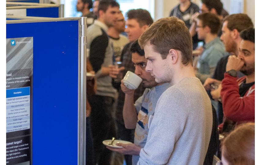 Participants at the 2019 SUPA-Cormack meeting read research posters